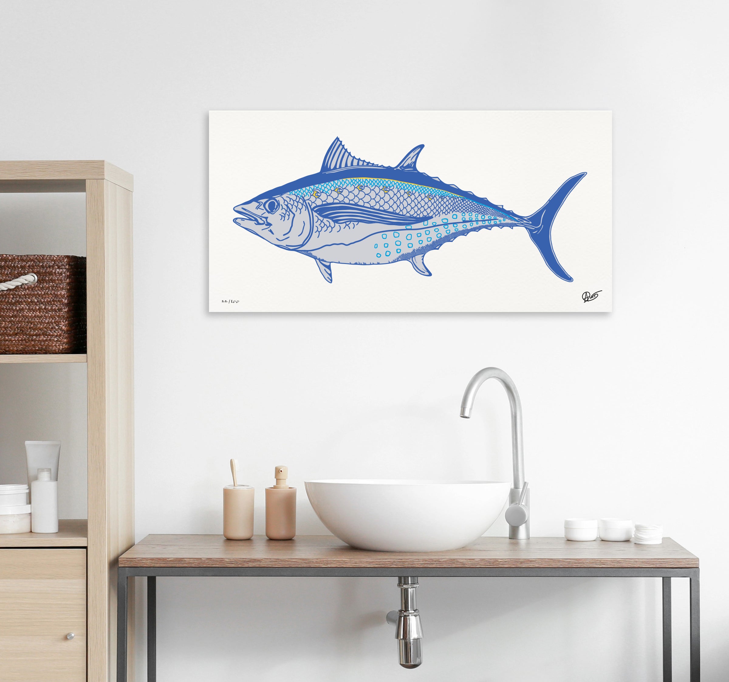 Albacore canvas print on a white wall above a bathroom sink.