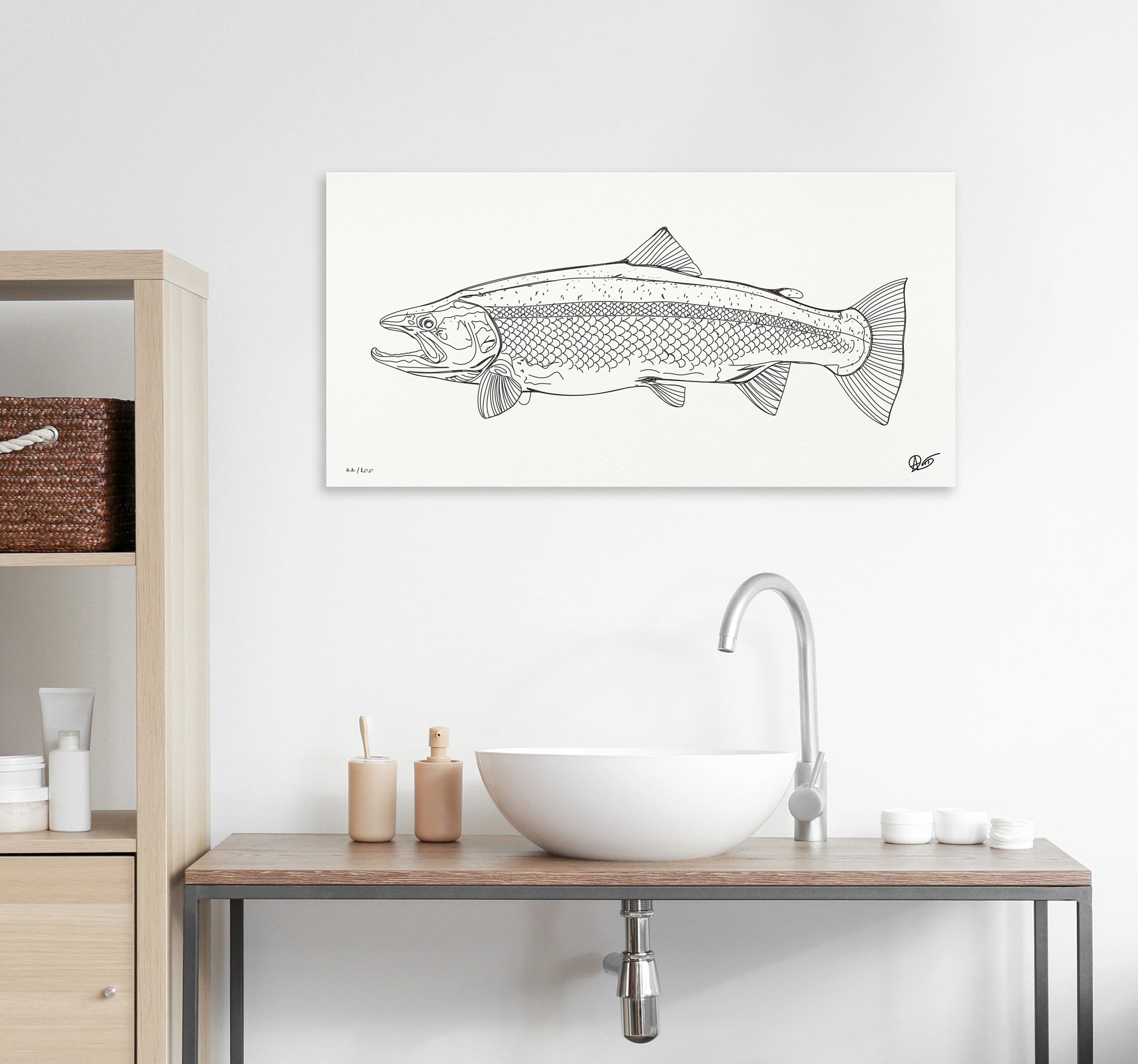 Steelhead canvas print on a wall above a bathroom sink with shelves and toiletries.