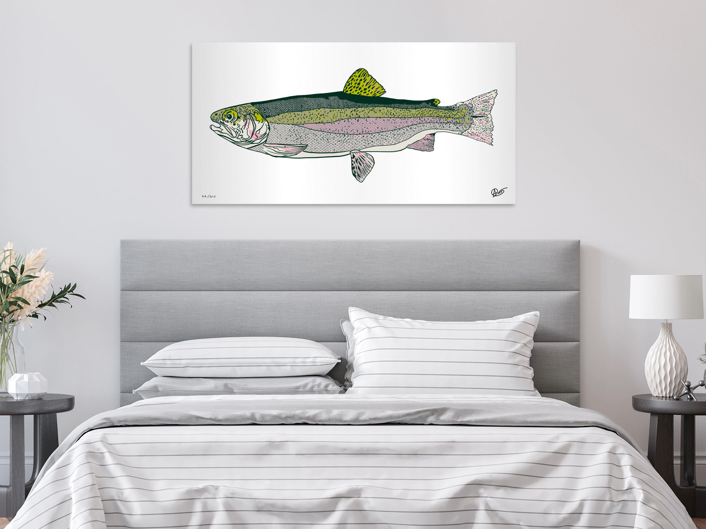 Bedroom with a metal rainbow trout print on the wall above the bed