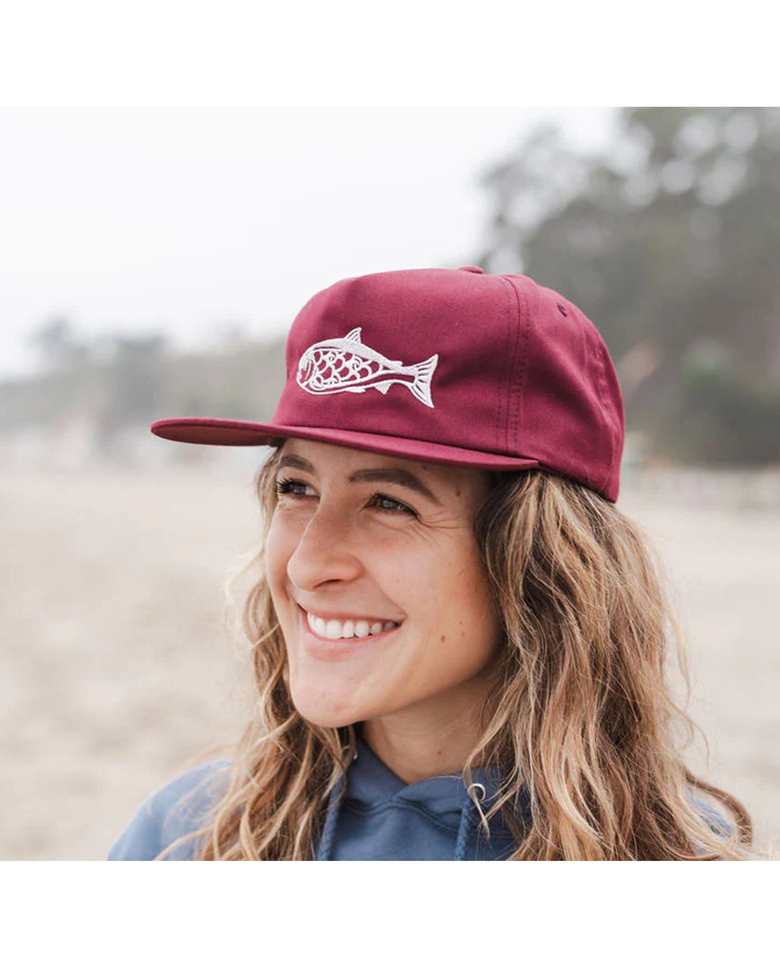 Salmon unstructured hat in maroon on model