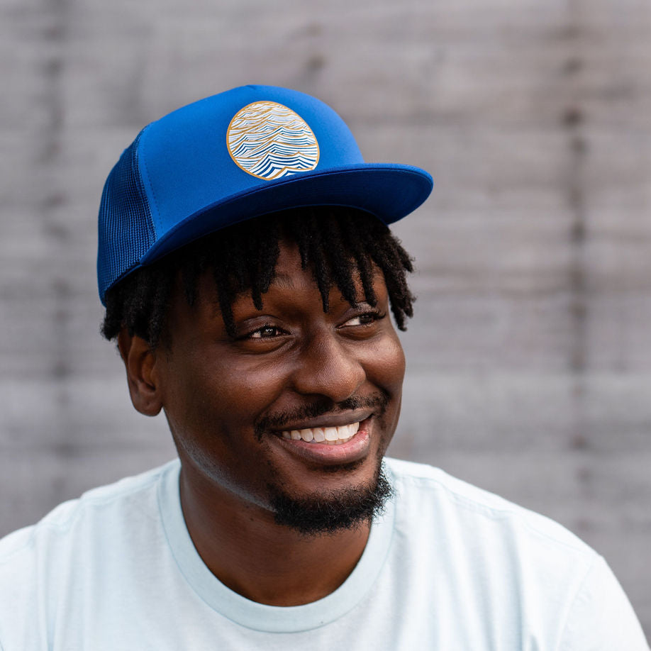 Blue trucker hat with water design