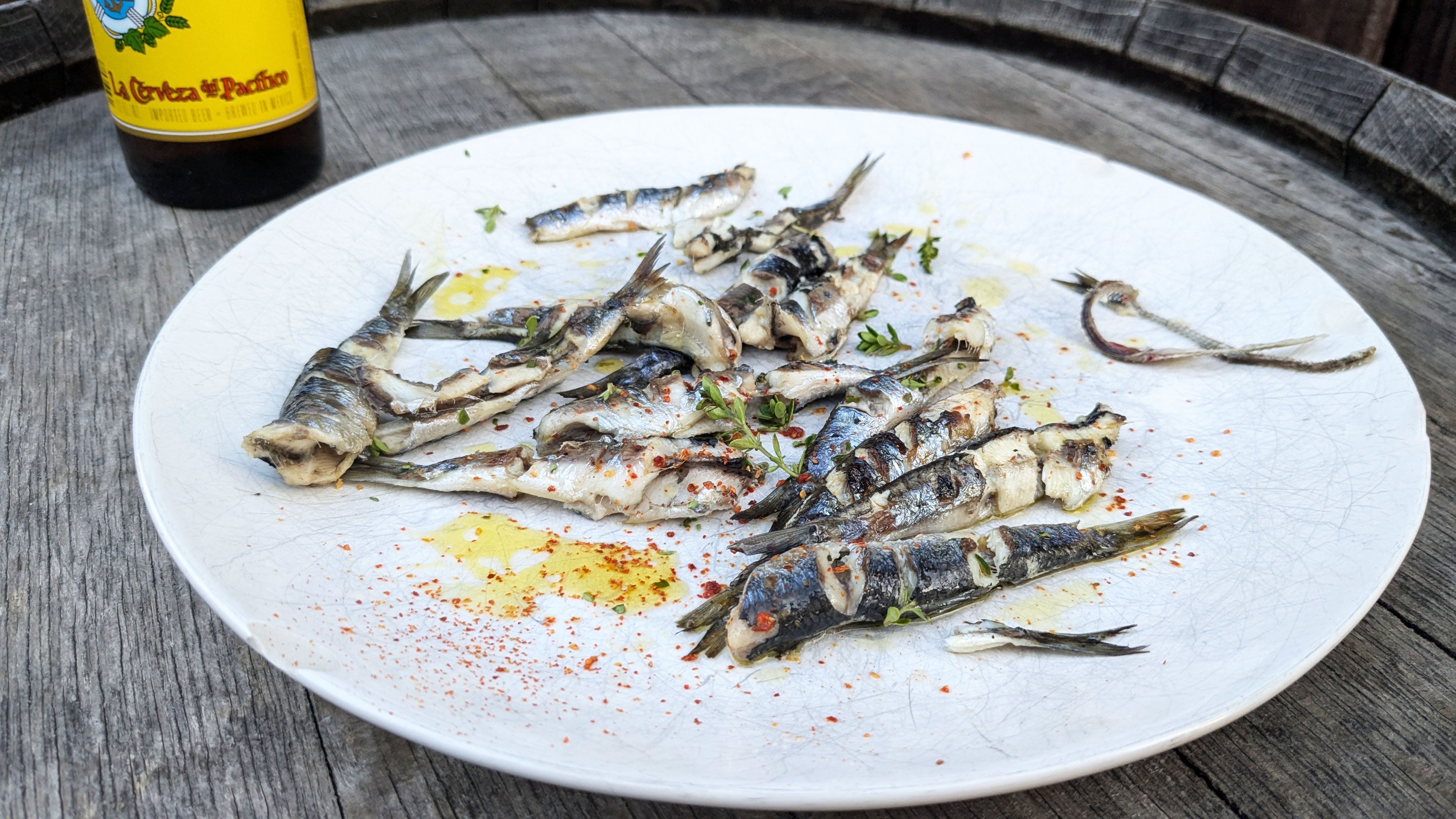 A tasty plate of grilled anchovies