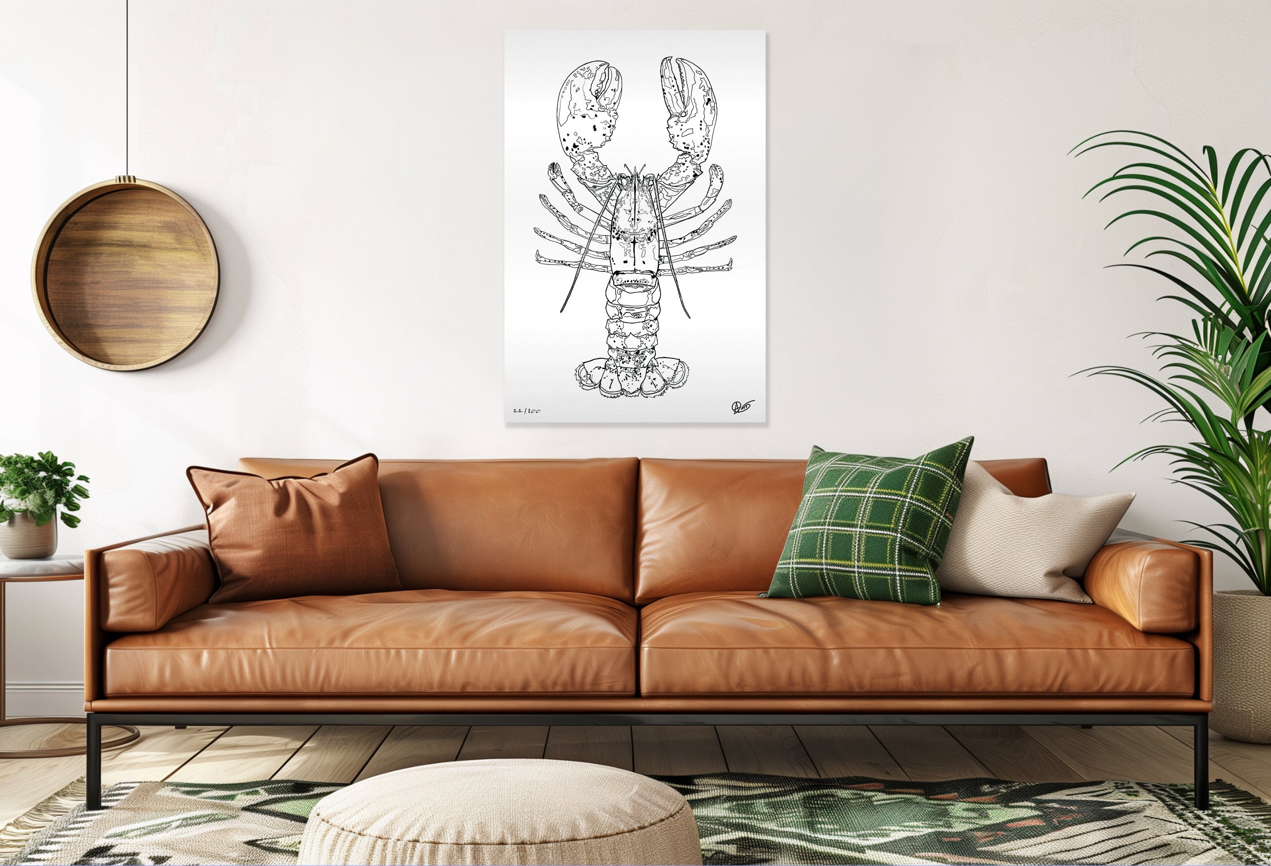 Brown leather sofa with decorative pillows in a living room setting, featuring a lobster illustration on the wall.