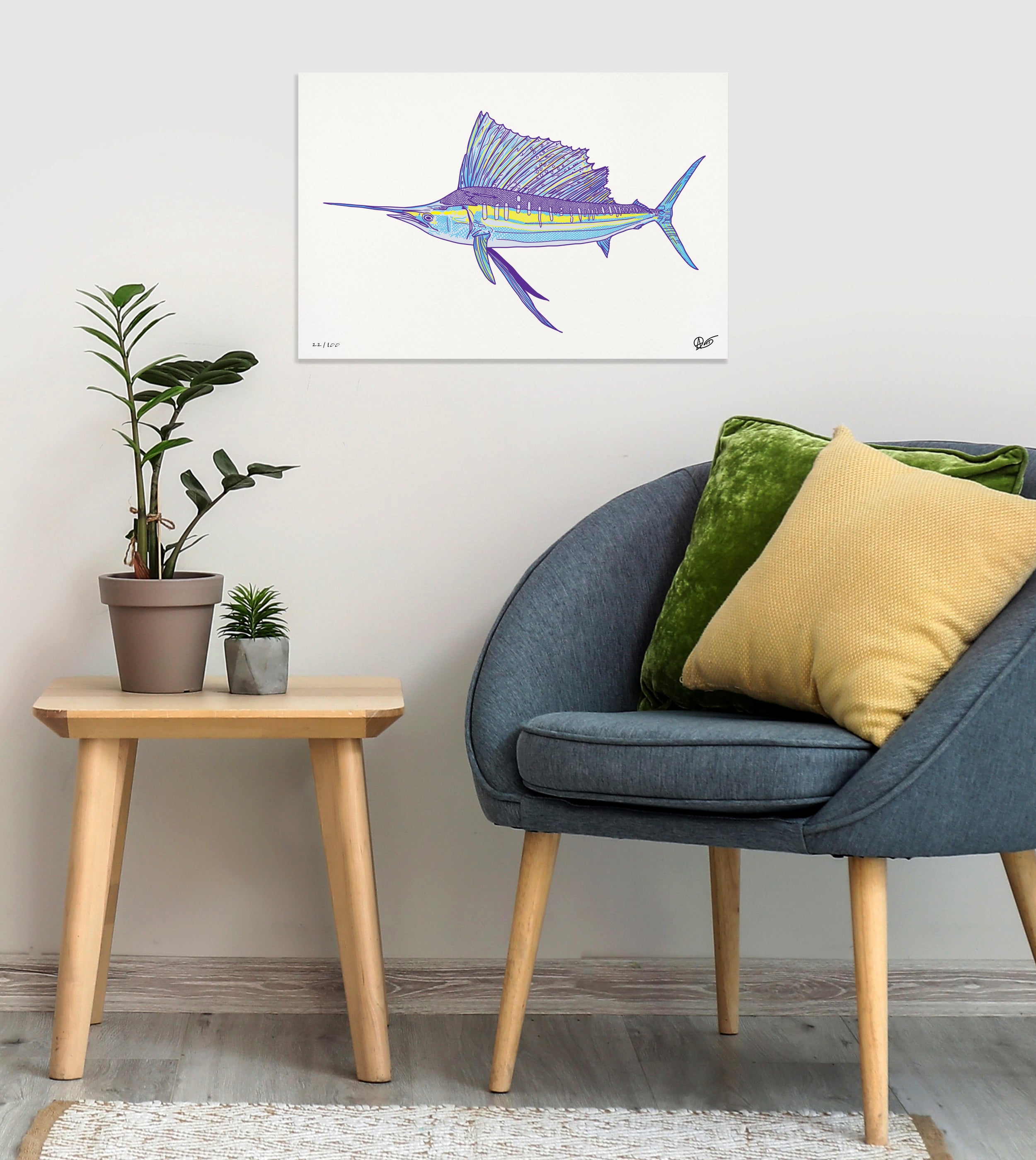 Living room with a blue chair, side table, and wall art of a sailfish.